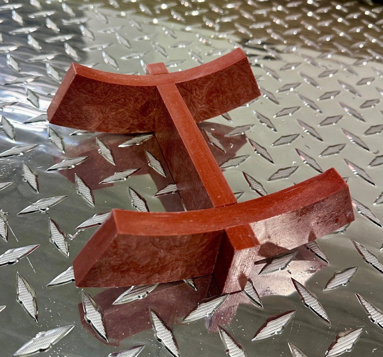 Core-Lok support, placed on a silver diamond plate surface.