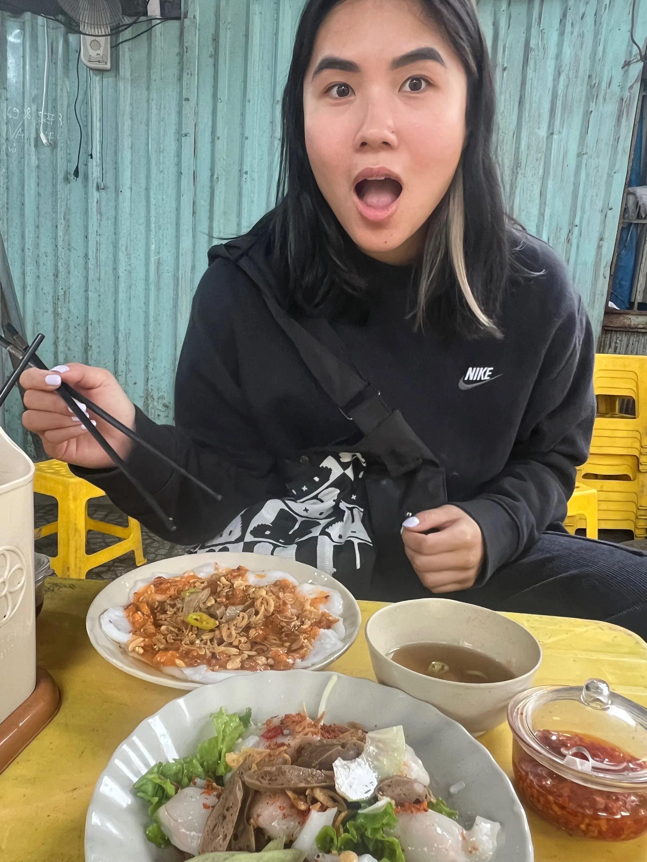 Christina Dinh enjoying a meal at a Vietnamese restaurant.