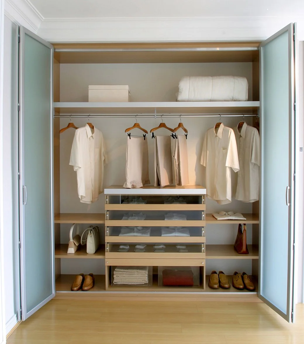 reach in closet with folding glass doors and drawers