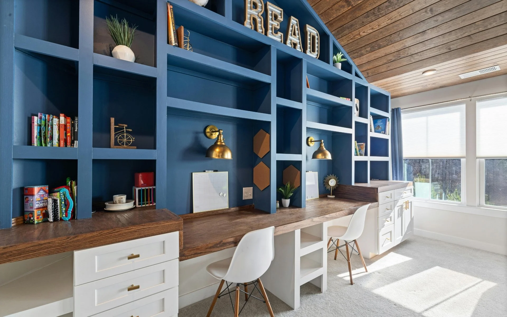 blue custom home office shelving and desktops