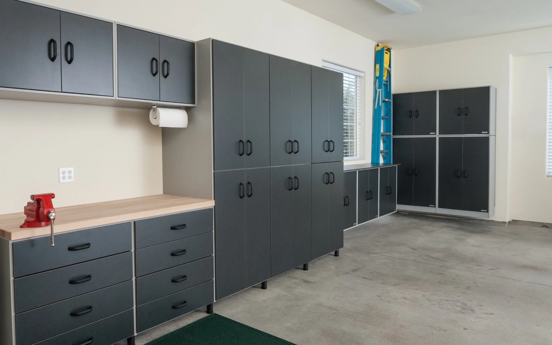 custom garage storage organization with gray cabinets