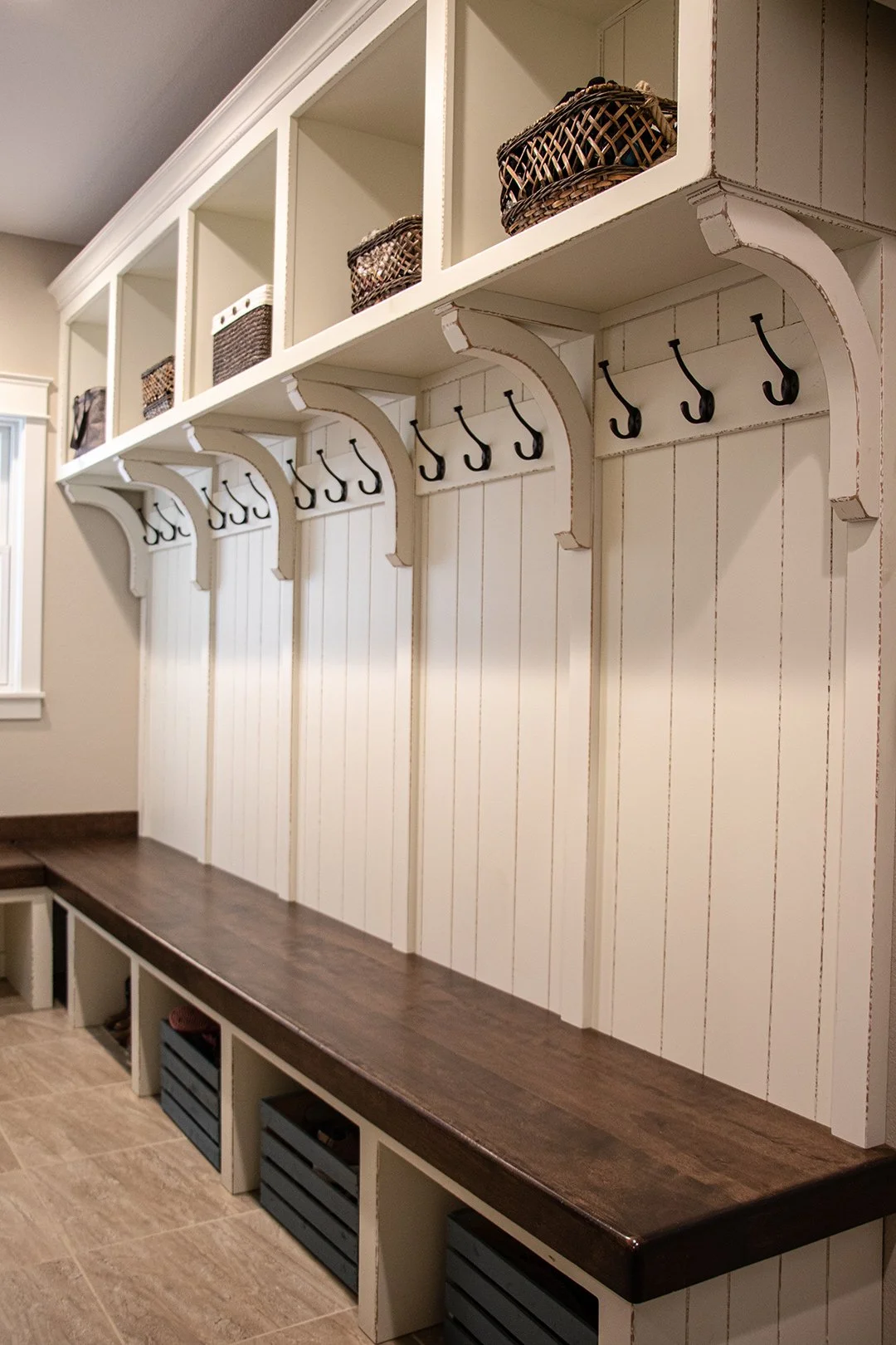 rustic custom mudroom with wood bench open storage and coat hooks
