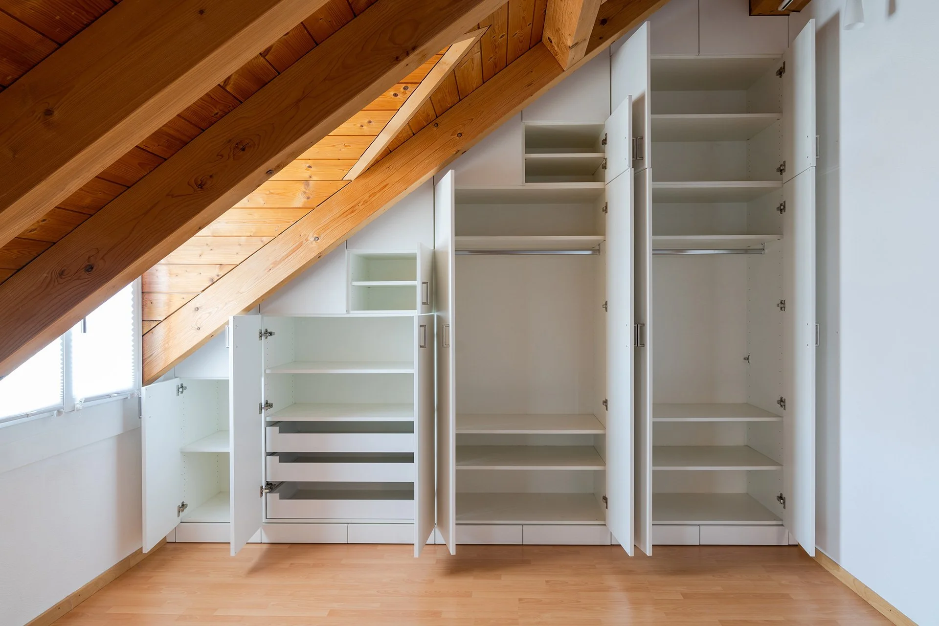 under stairs organization with shelving and cabients