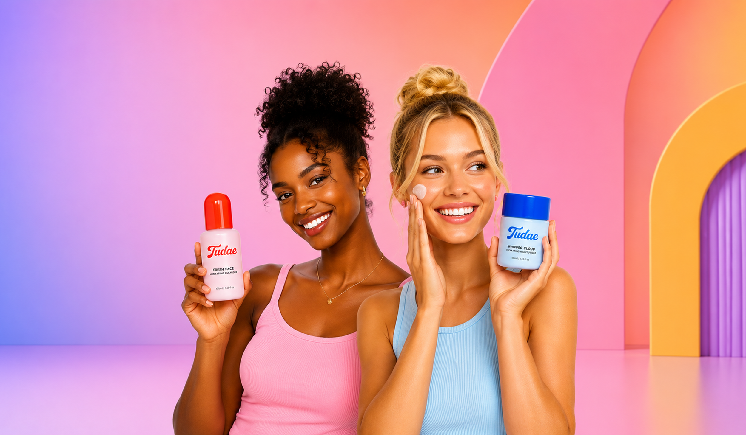 Two women holding skincare products, smiling, with colorful pink, purple, and yellow background.