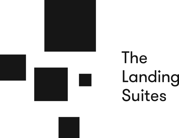 Logo for The Landing Suites with a stylized camera icon on the left and the text 'The Landing Suites' on the right.