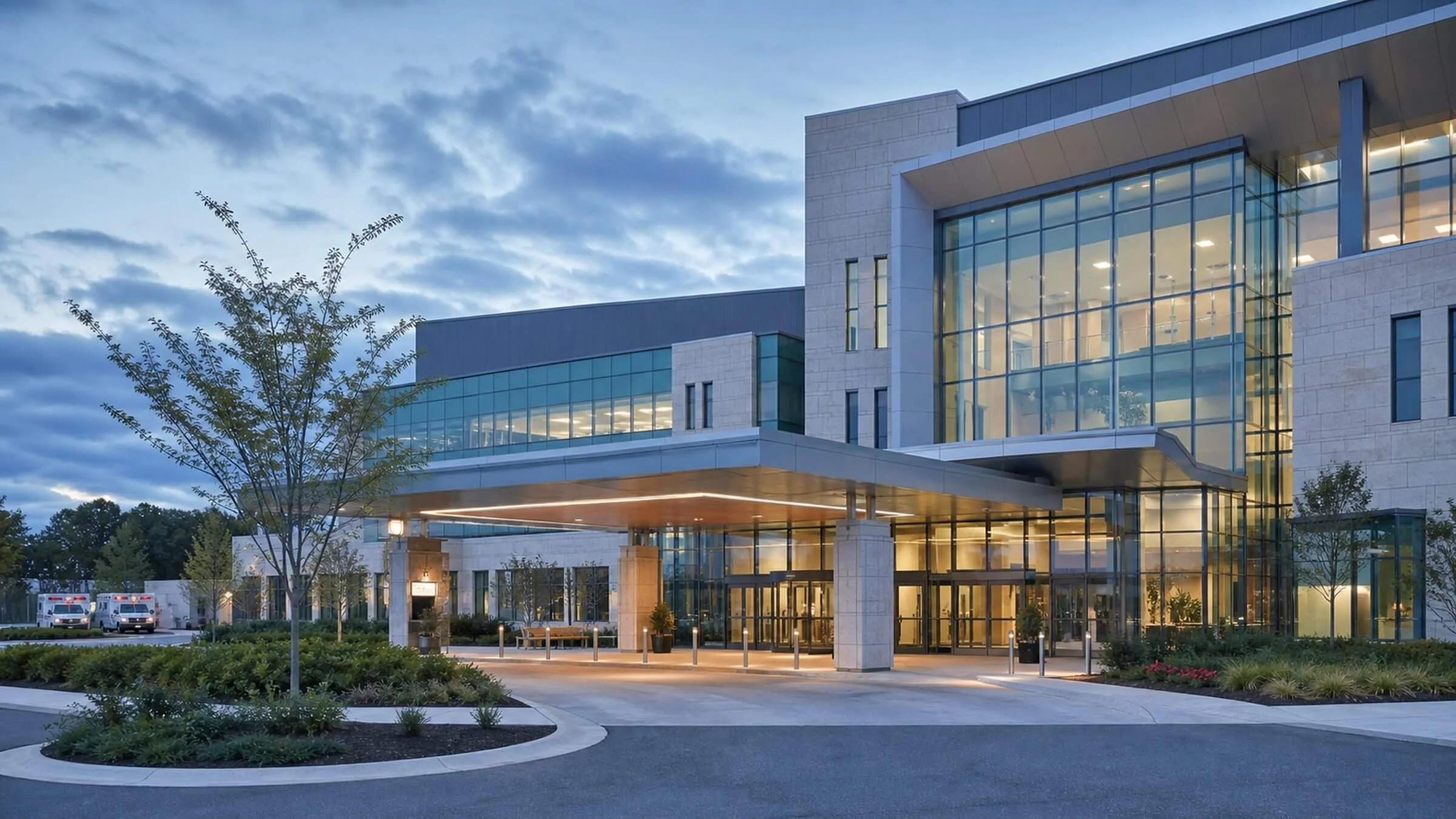Modern hospital and outpatient healthcare facility with covered entrance
