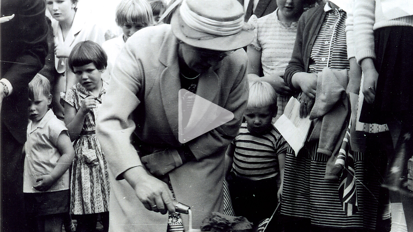 An archival photograph of Mrs Vander Laan laying the first brick at Calvin Christian School Senior Campus circa 1960