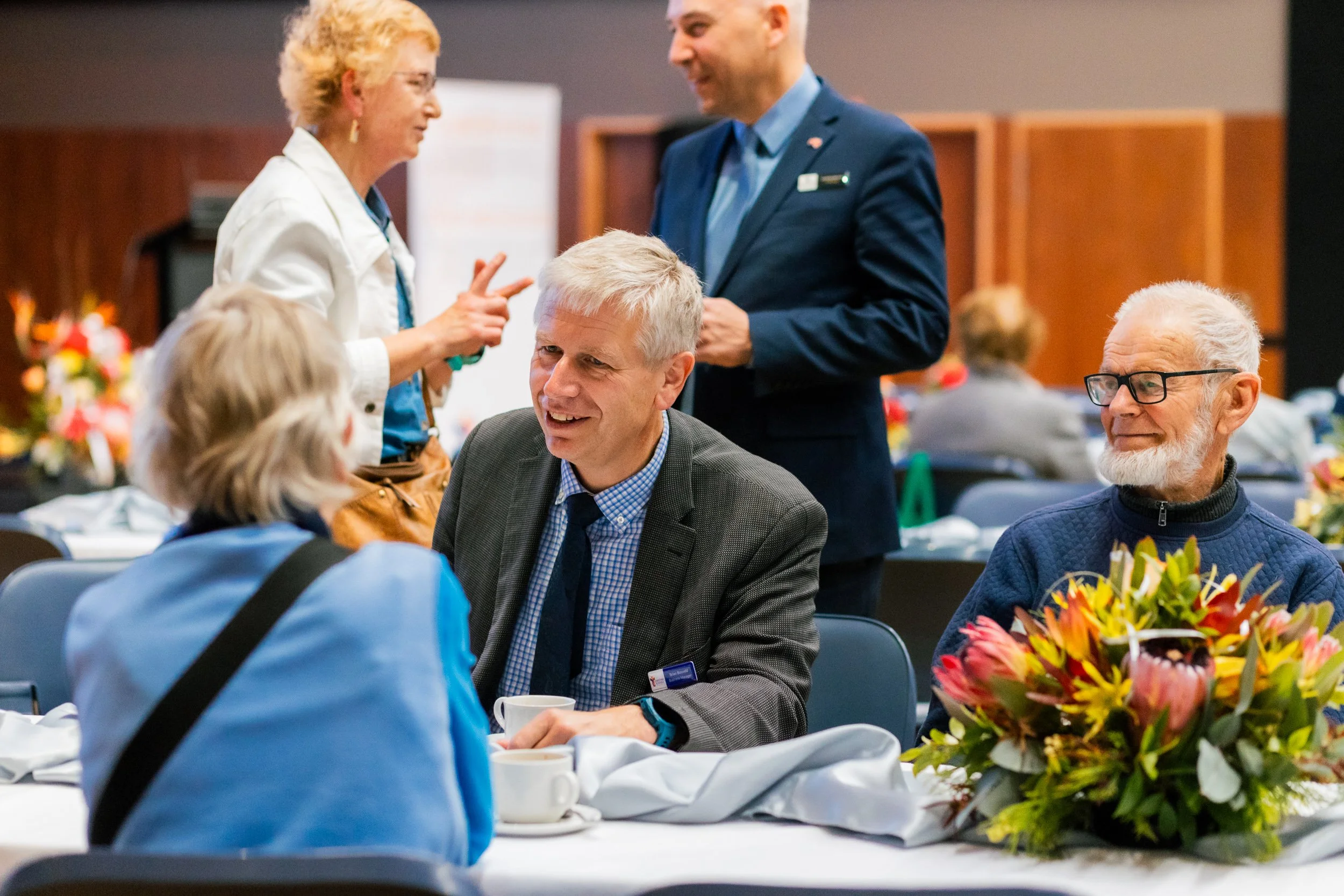 Gold members of Christian Schools Tasmania talking together at an annual meeting