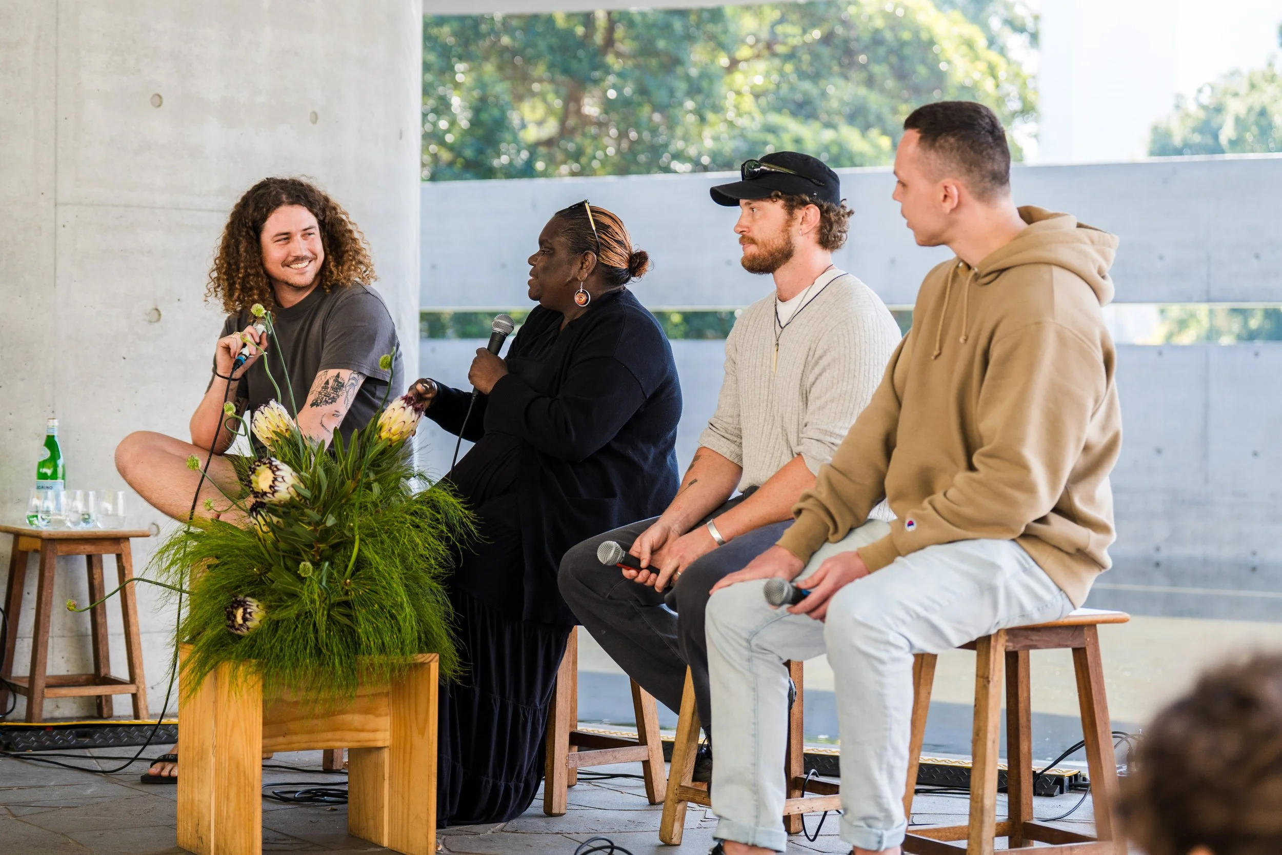 Bradley Kerr in conversation with three panellists at a BLAKitecture talk at MPavilion