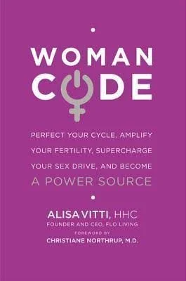 Book cover titled "Woman Code," purple background, with a symbol combining a female sign and power button icon, and text about improving fertility, sex drive, and becoming a power source, authored by Alisa Vitti, HHC.