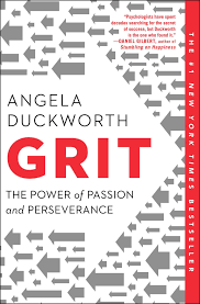 Book cover of 'Grit' by Angela Duckworth, featuring a red and white design with gray arrows and the subtitle 'The Power of Passion and Perseverance'