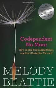 Book cover titled 'Codependent No More' by Melody Beattie, featuring a dandelion seed head with a single seed blowing away and a sticker about winning a million.
