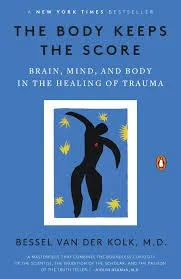 Book cover of 'The Body Keeps the Score' by Bessel Van Der Kolk, featuring a stylized black human figure with stars and a crescent moon around it, on a blue background.