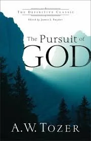 Book cover of "The Pursuit of God" by A.W. Tozer, featuring a mountain landscape with trees and a sky gradient from dark to light.