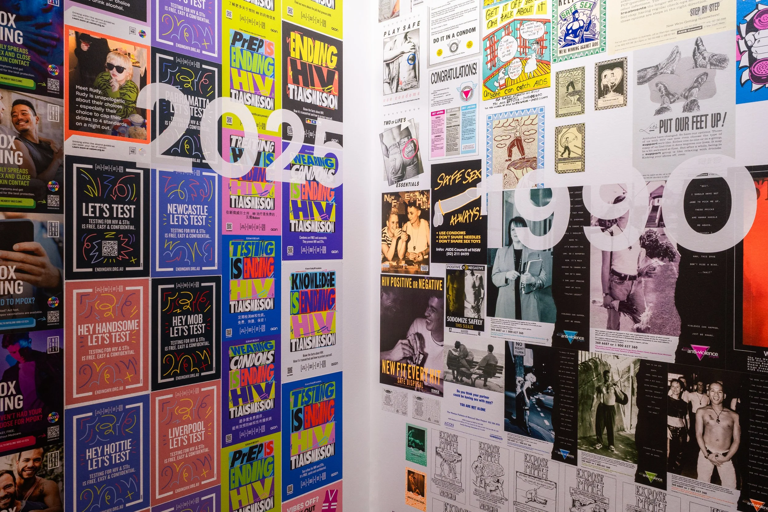 A wall covered with various posters and flyers about HIV testing, sexual health, safe sex, and related awareness campaigns. The posters include colorful graphics, text, and images of people.