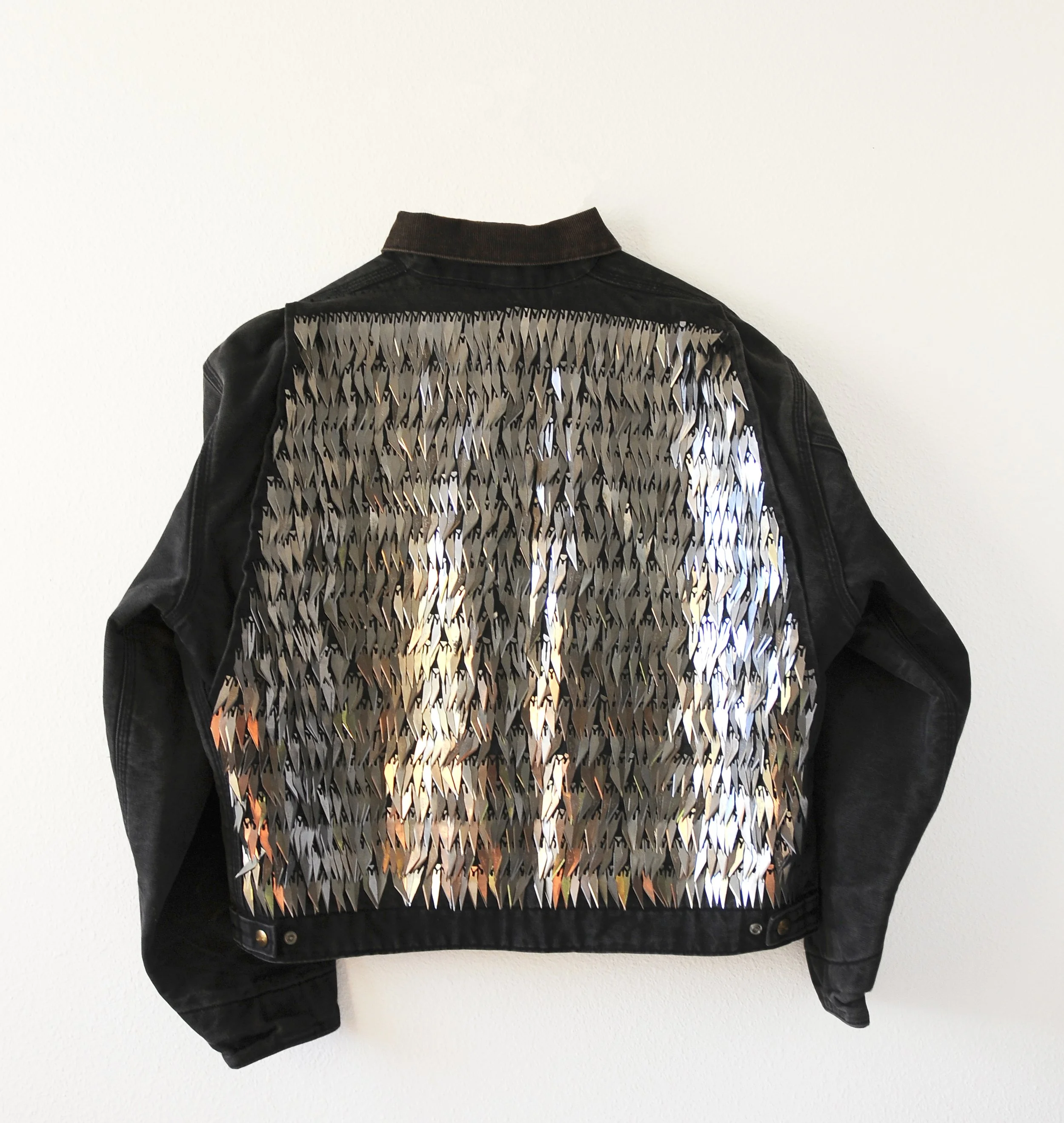 Jacket (The Walk), 2023

The dulled X-ACTO blades used during the course of cutting the piece 'The Walk' hand sewn onto a workwear jacket. 