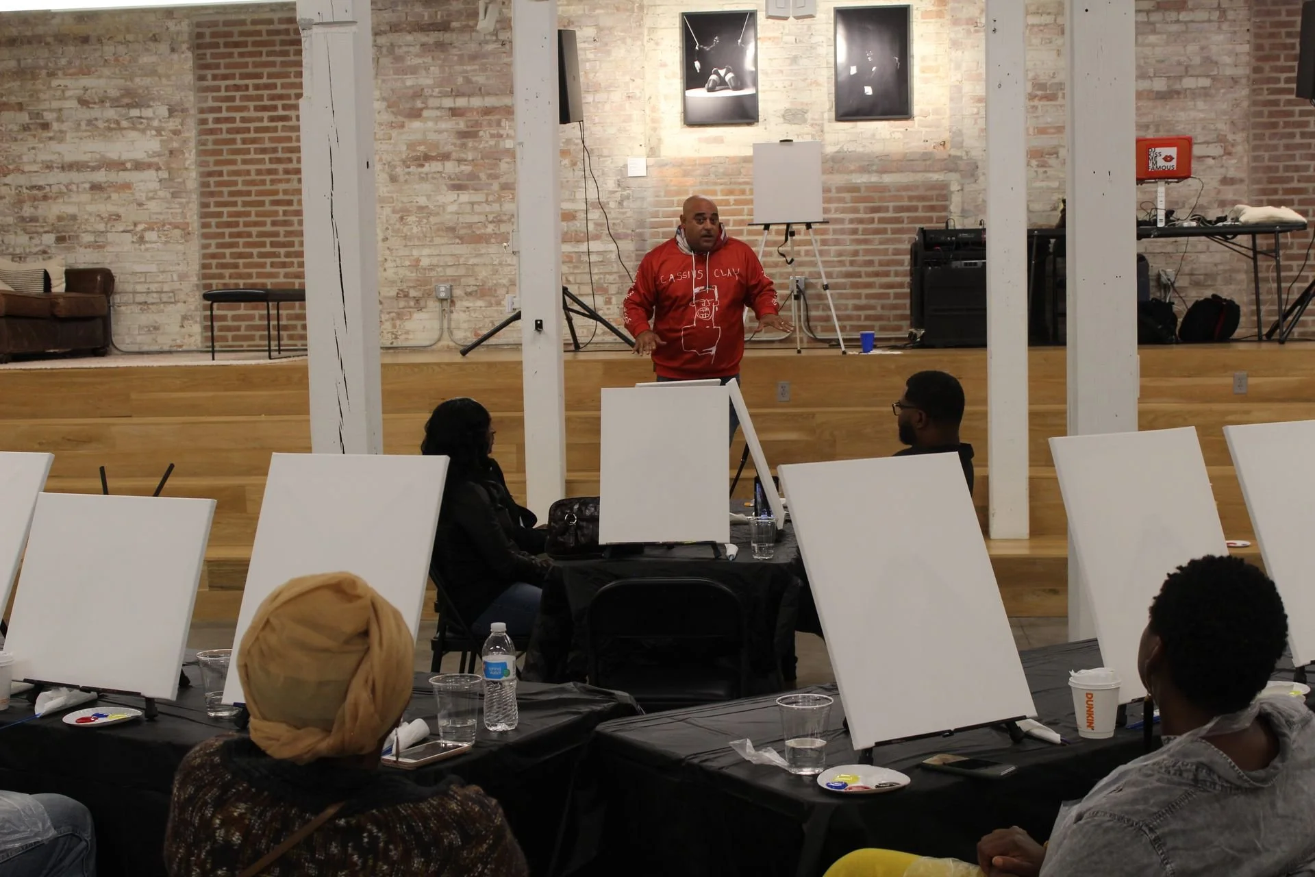 Spit and Paint, a Winning Ways Program. An event attendee standing in front of the group.