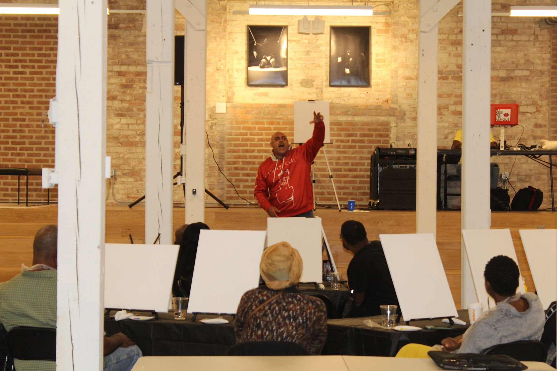 Spit and Paint, a Winning Ways Program. A man at the front spitting to the group.