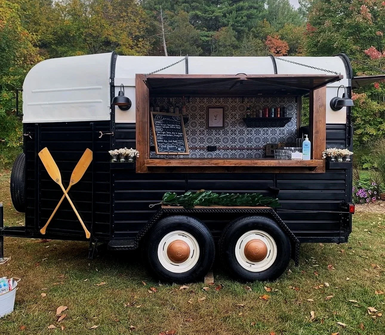 Vintage bar trailer with customized decor for a private event.
