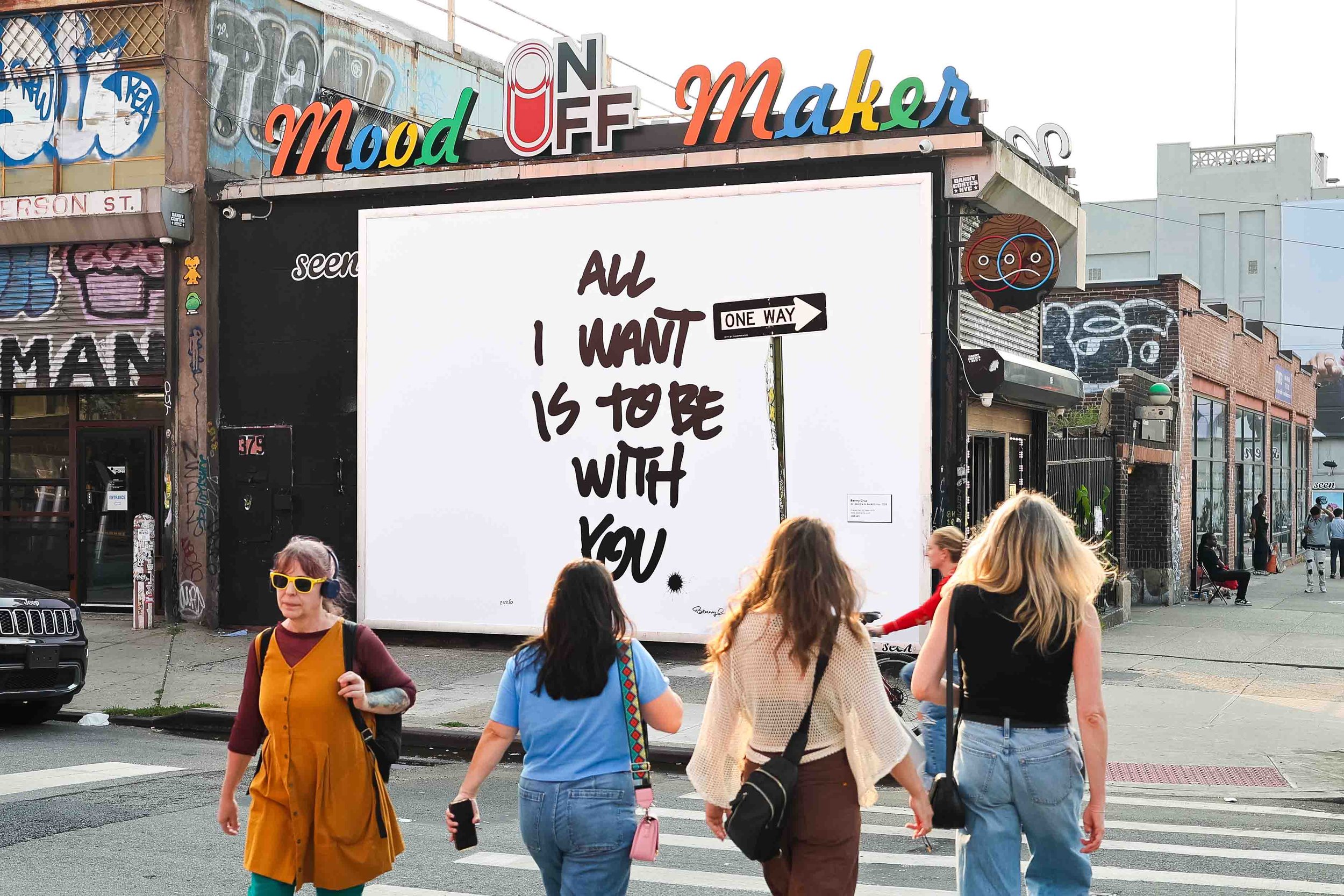 Brooklyn pedestrians viewing Benny Cruz artwork