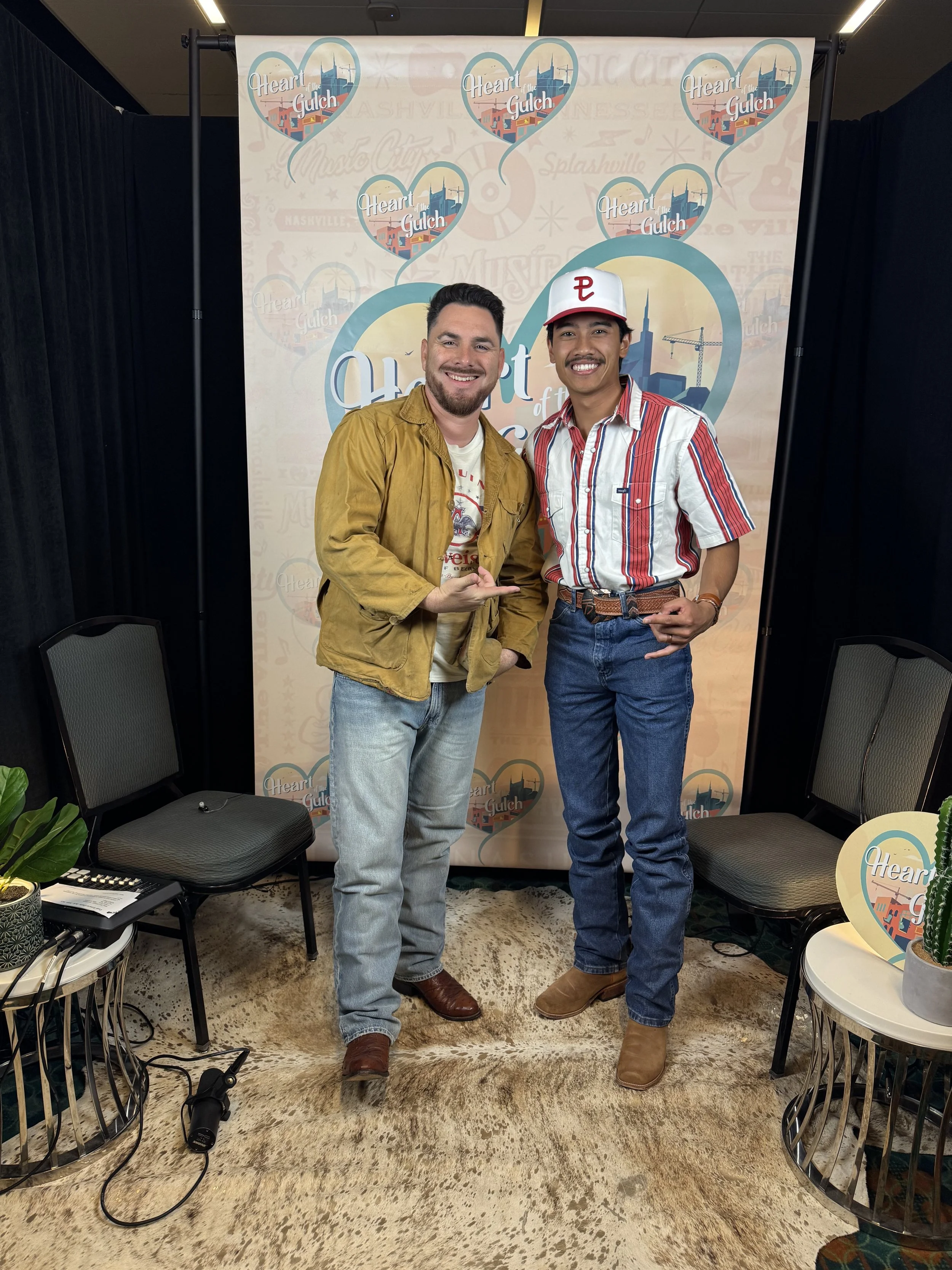 Tony Mendoza and country artist Dzaki Sukarno pose together following their Heart of the Gulch interview during CMA Fest in Nashville.