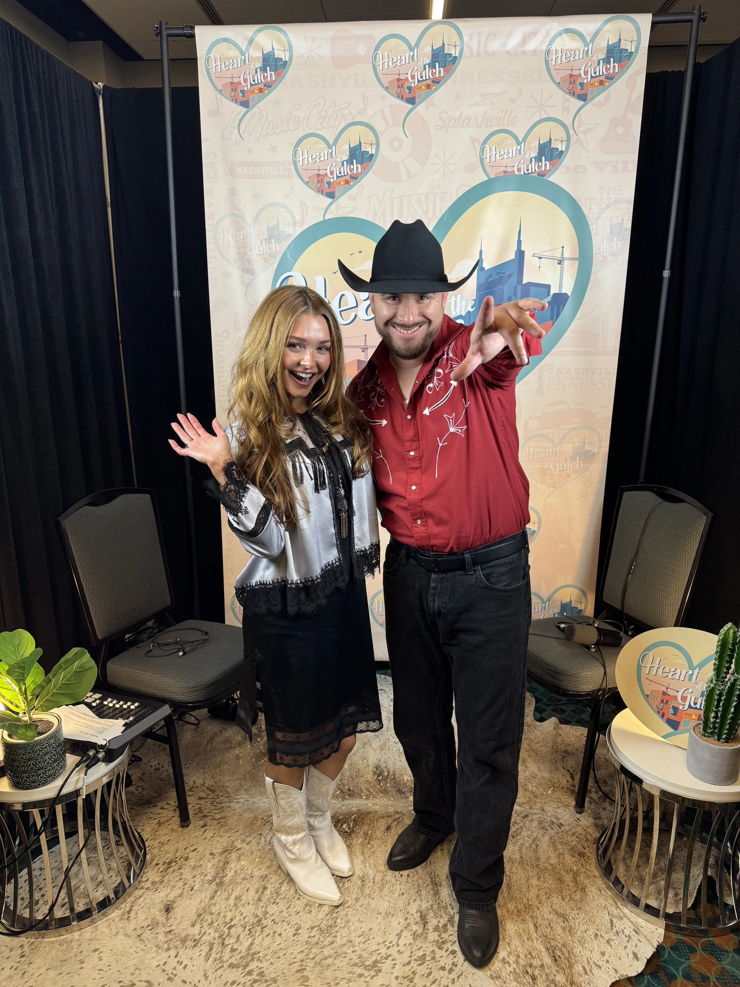 Tony Mendoza and singer-songwriter Gabi Sklar pose together following their Heart of the Gulch interview during CMA Fest in Nashville.