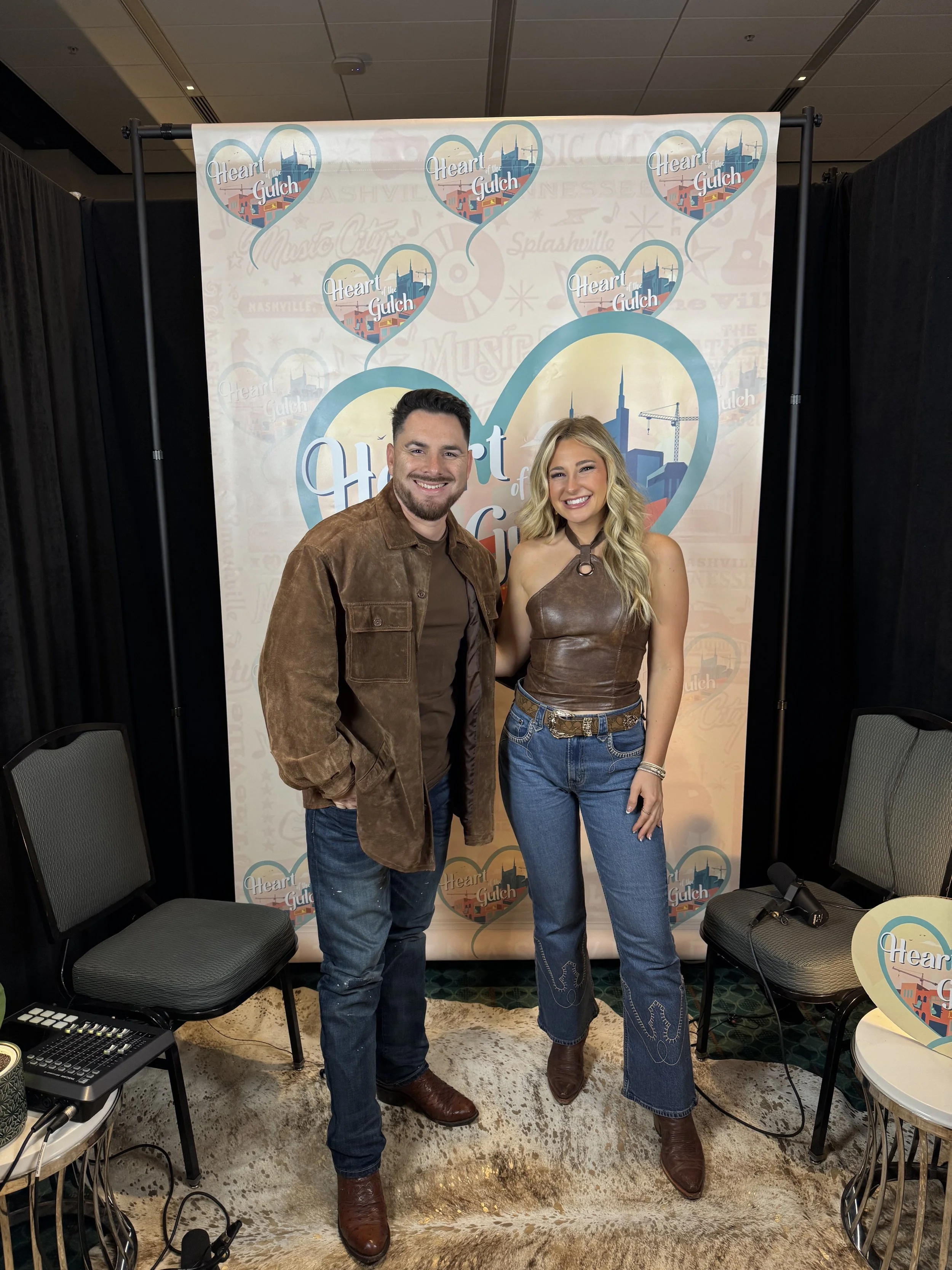 Tony Mendoza, host of Heart of the Gulch, and Erin Kinsey pose together following their CMA Fest 2025 interview in Nashville TN