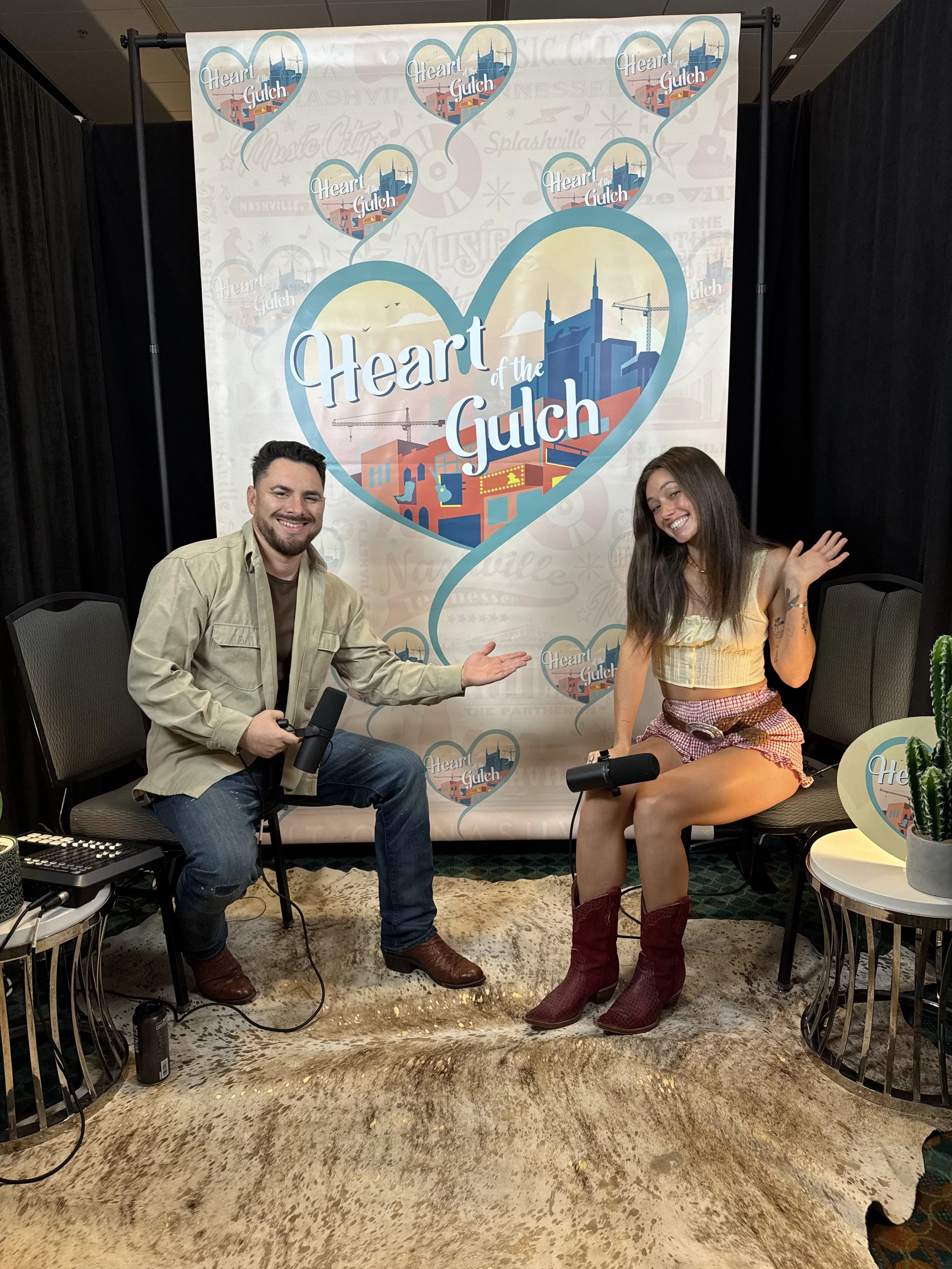 Tony Mendoza, host of Heart of the Gulch, and Brooke Lee pose together after their CMA Fest 2025 interview in Nashville.