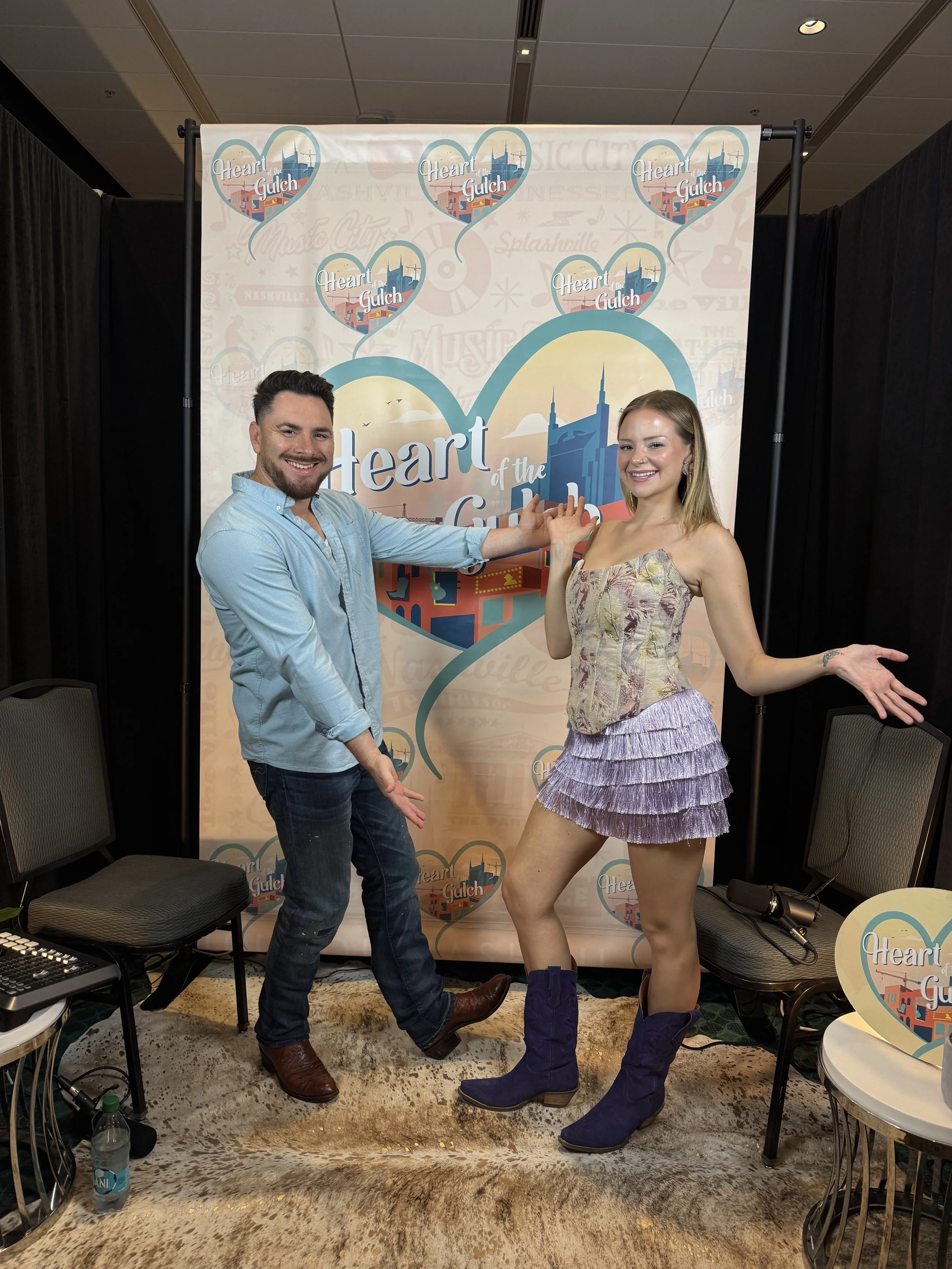 Tony Mendoza, host of Heart of the Gulch, and Abbie Callahan pose together after their CMA Fest 2025 interview in Nashville TN.
