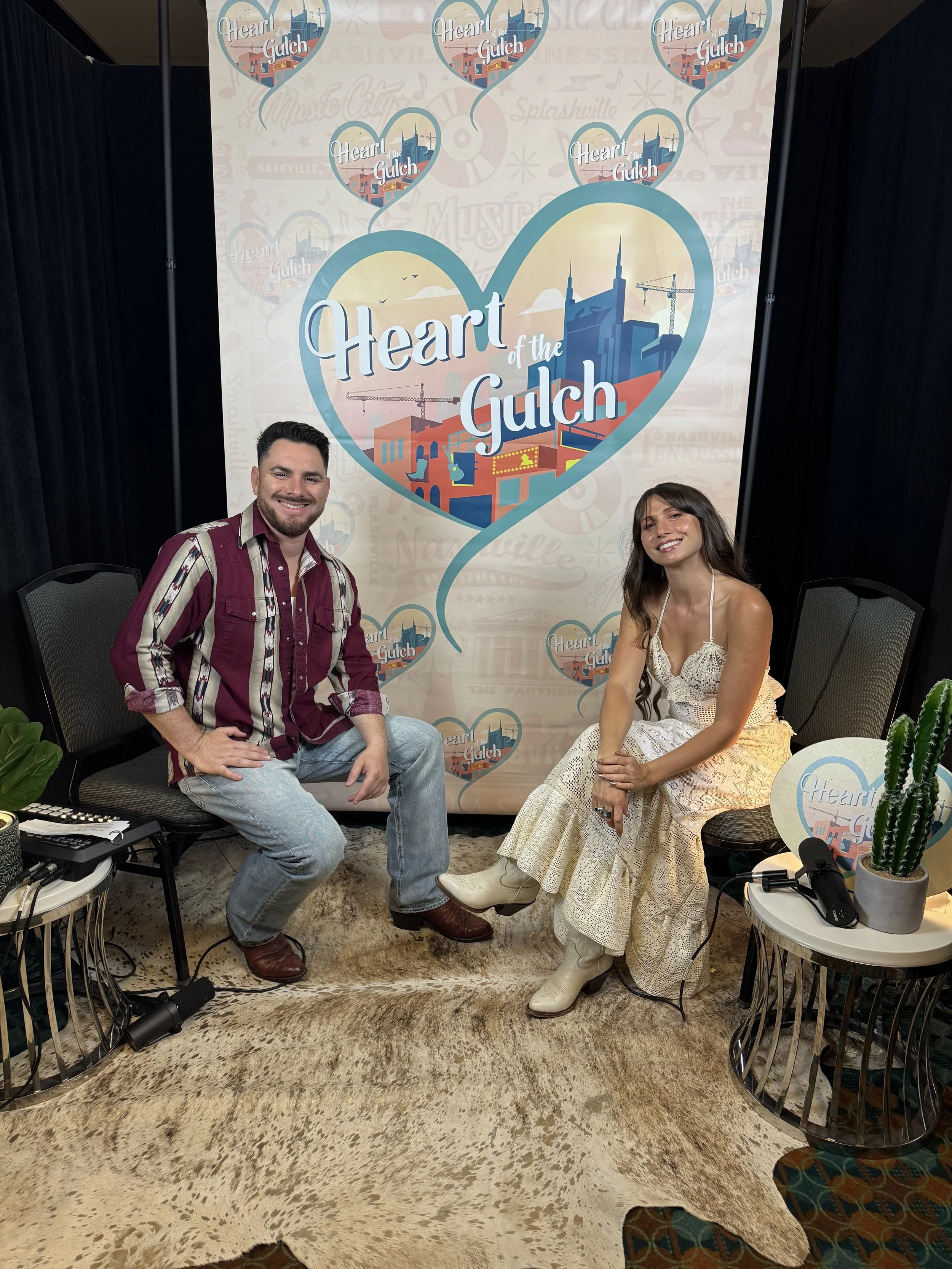 Tony Mendoza, host of Heart of the Gulch, and Lily Meola pose together after their CMA Fest 2025 interview in Nashville.