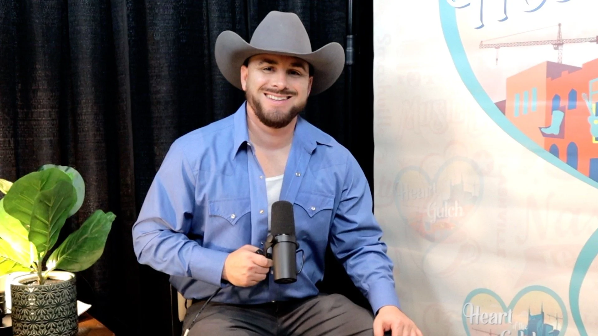 ony Mendoza and country-rock artist Ben Gallaher pose together following their Heart of the Gulch interview at Country Radio Seminar (CRS) 2026 in Nashville.