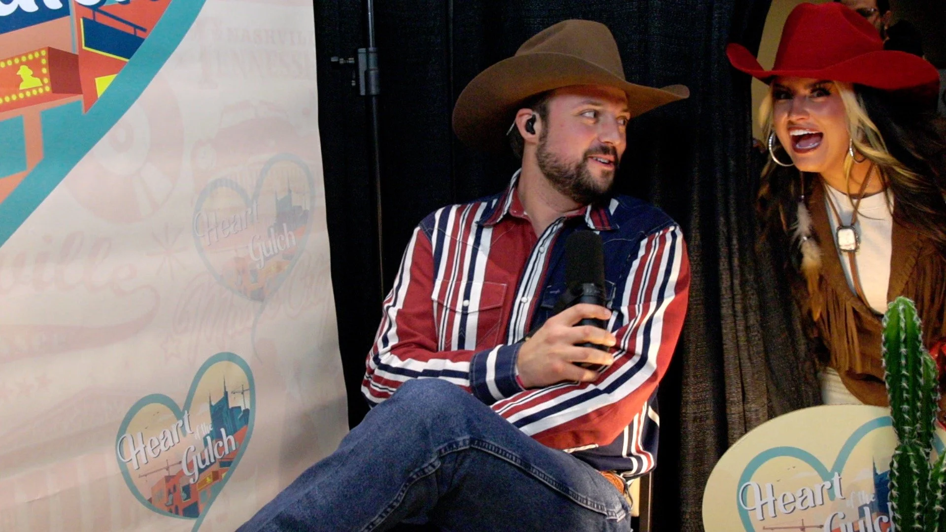 Taylor Austin Dye SURPRISE and country artist Walker Montgomery pose together following their Heart of the Gulch interview at Country Radio Seminar (CRS) 2026 in Nashville.