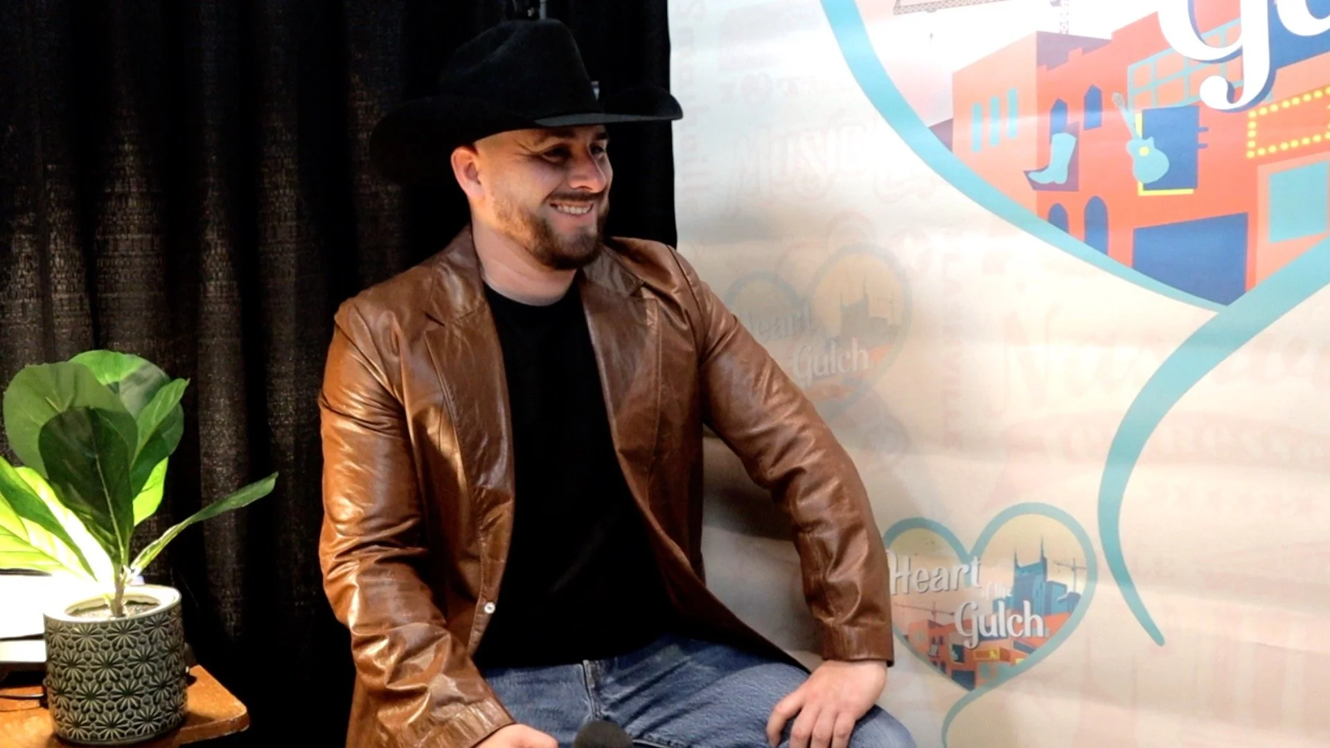 Tony Mendoza and country artist Taylor Austin Dye pose together following their Heart of the Gulch interview at Country Radio Seminar (CRS) 2026 in Nashville.