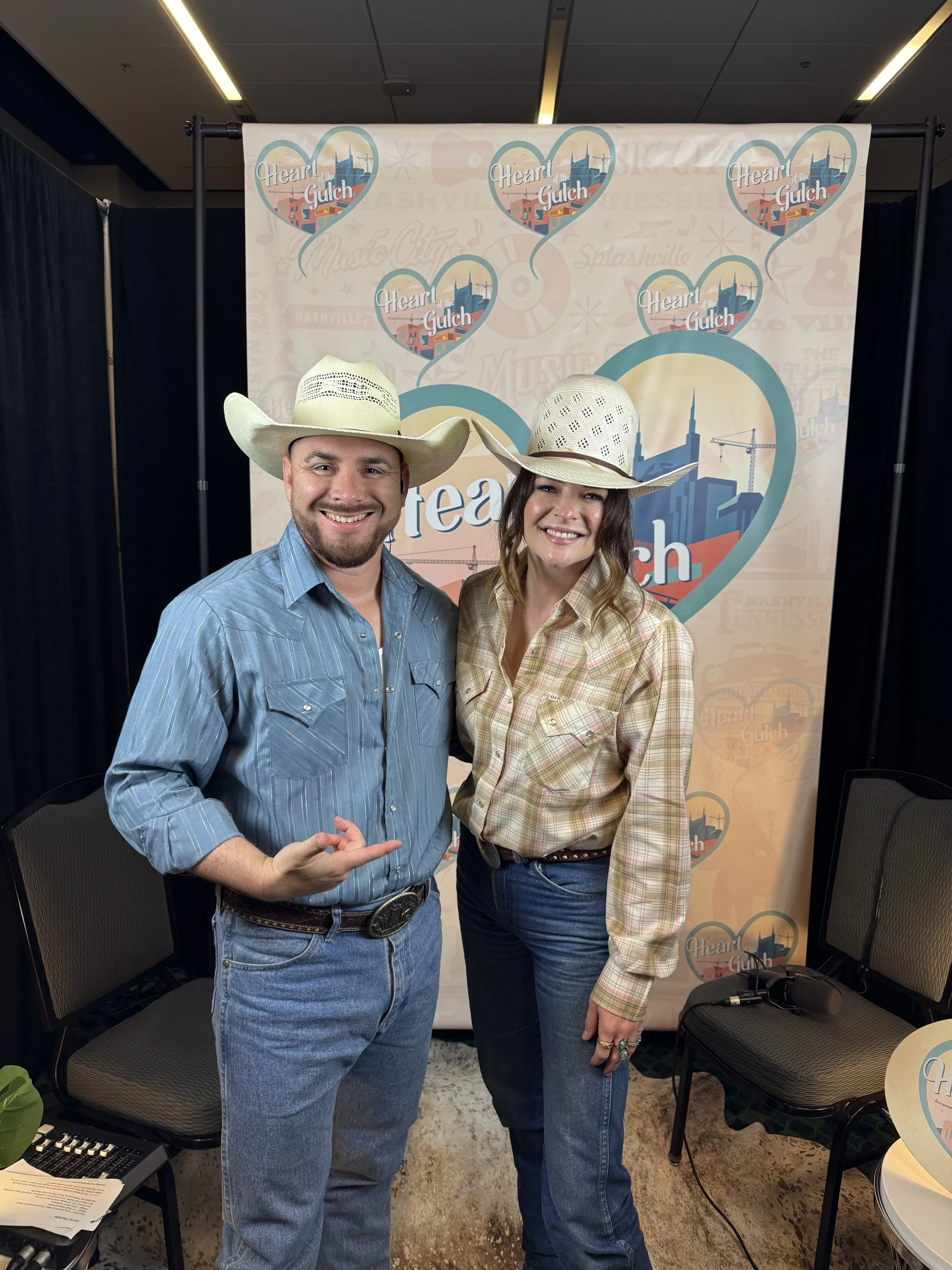 Tony Mendoza and country artist Jenna Paulette pose together following their Heart of the Gulch interview during CMA Fest in Nashville.