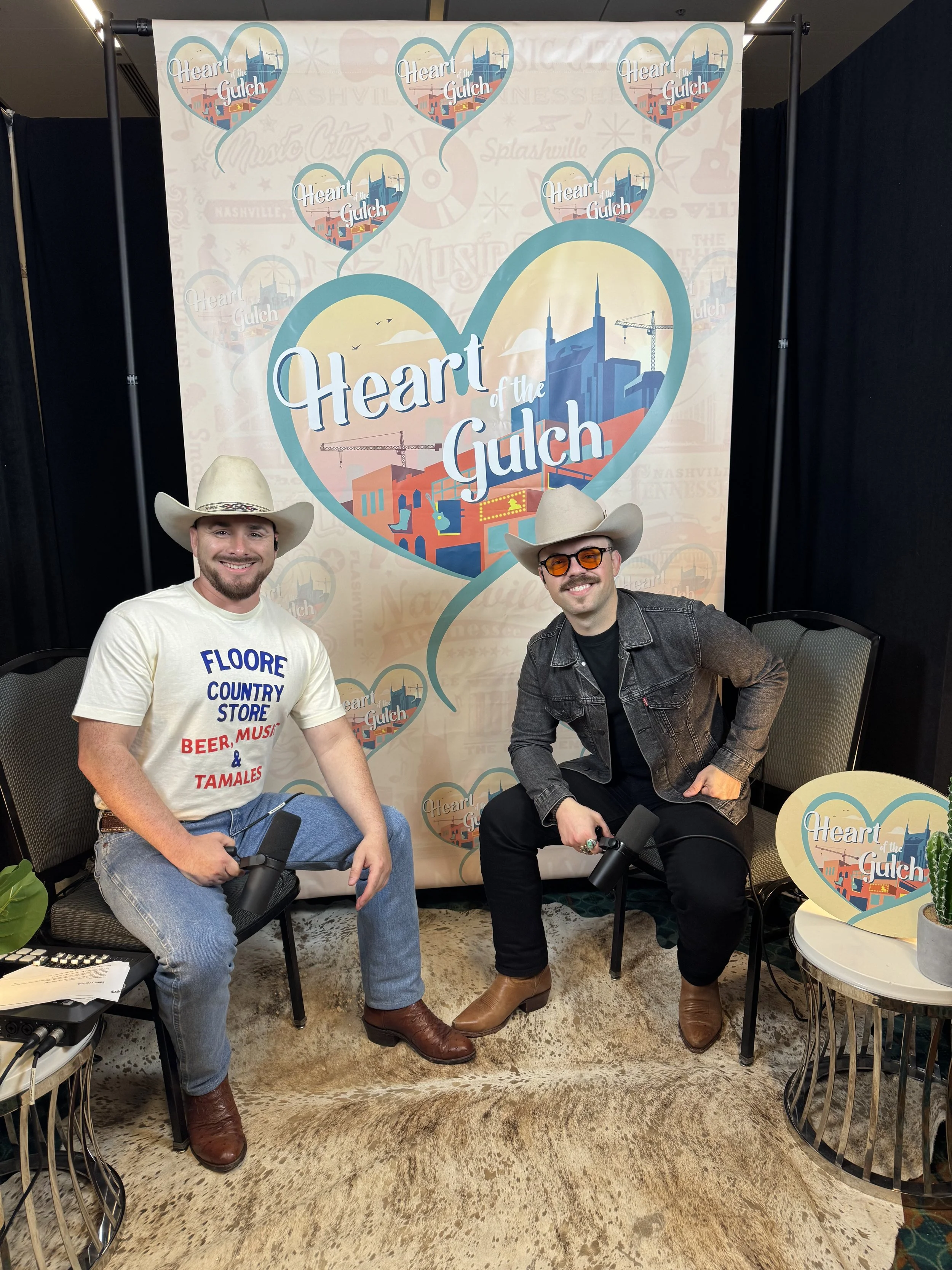 Tony Mendoza, host of Heart of the Gulch, and country artist Sammy Arriaga pose together after their CMA Fest 2025 interview in Nashville.