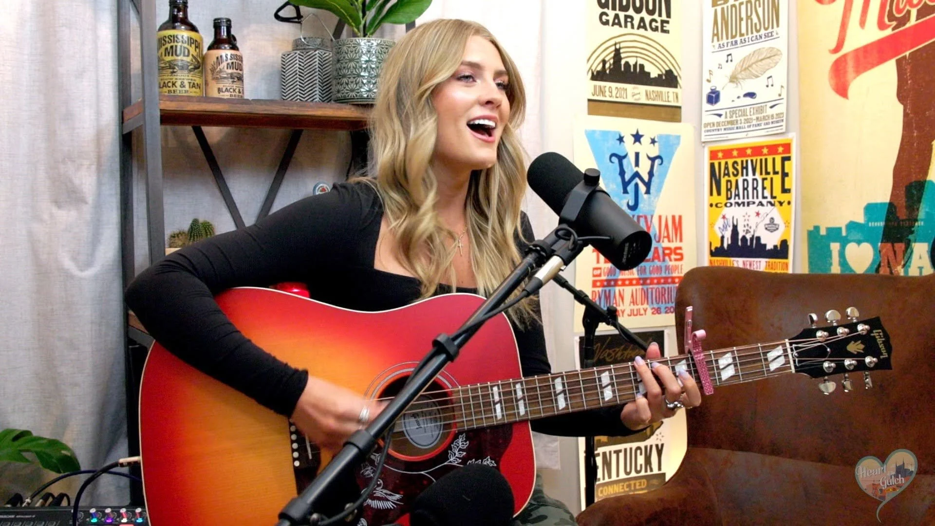 Country singer-songwriter Faith Schueler performing a song inside the Heart of the Gulch studio in Nashville, Tennessee.