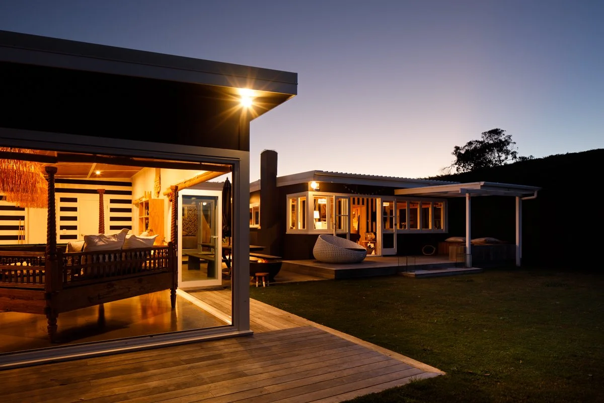Night time image showing new addition with new living space - after addition to house