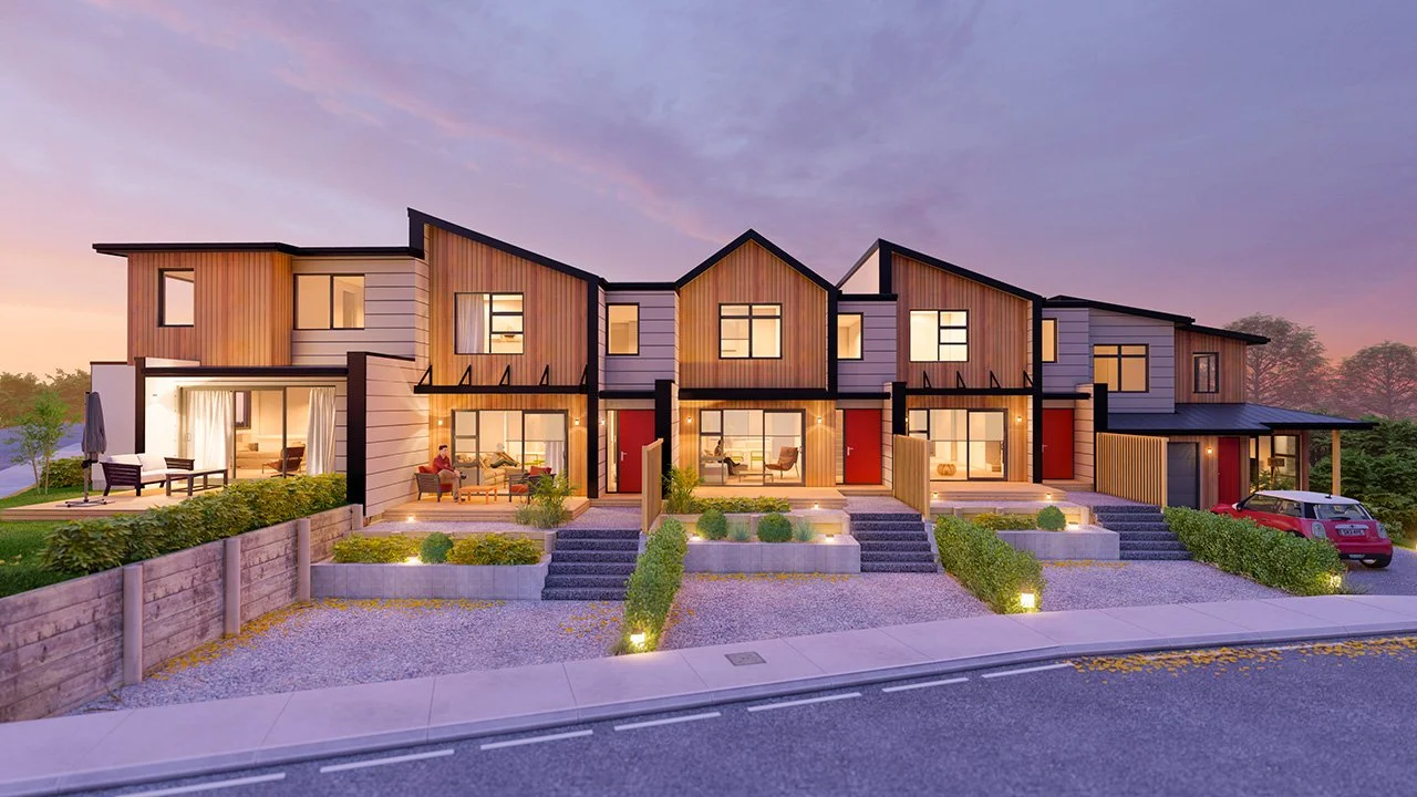 Modern multi-unit residential building with multiple front entrances, outdoor seating areas, and a parked car, during sunset