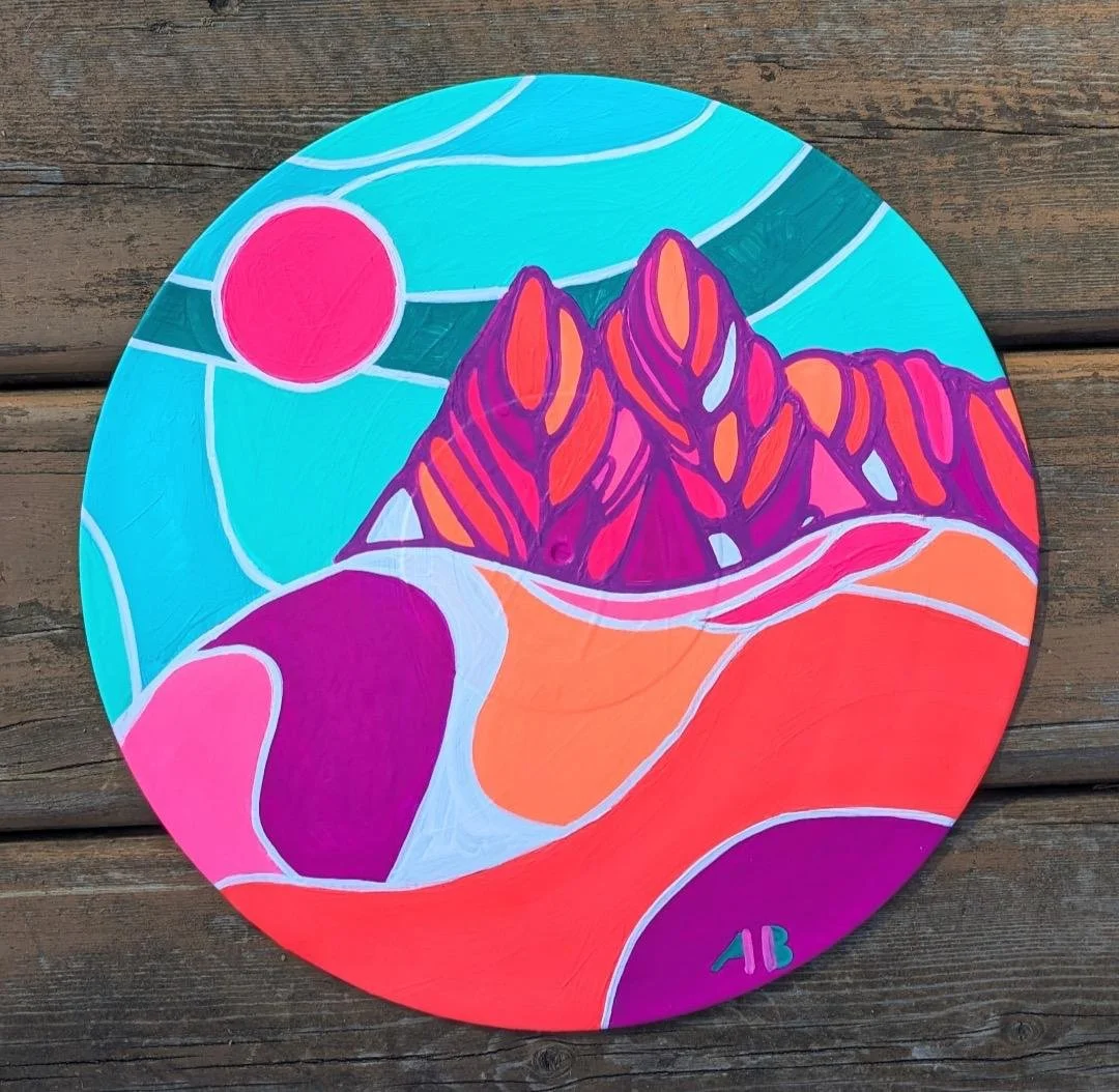 A colorful abstract painting of a mountain landscape with a pink sun, flowing lines, and vibrant hues of blue, purple, pink, orange, and red.
