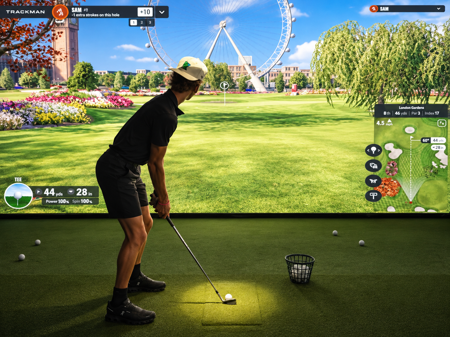 Golfer hitting a shot on a TrackMan golf simulator at Summit Swing indoor golf club in Maple Grove, MN