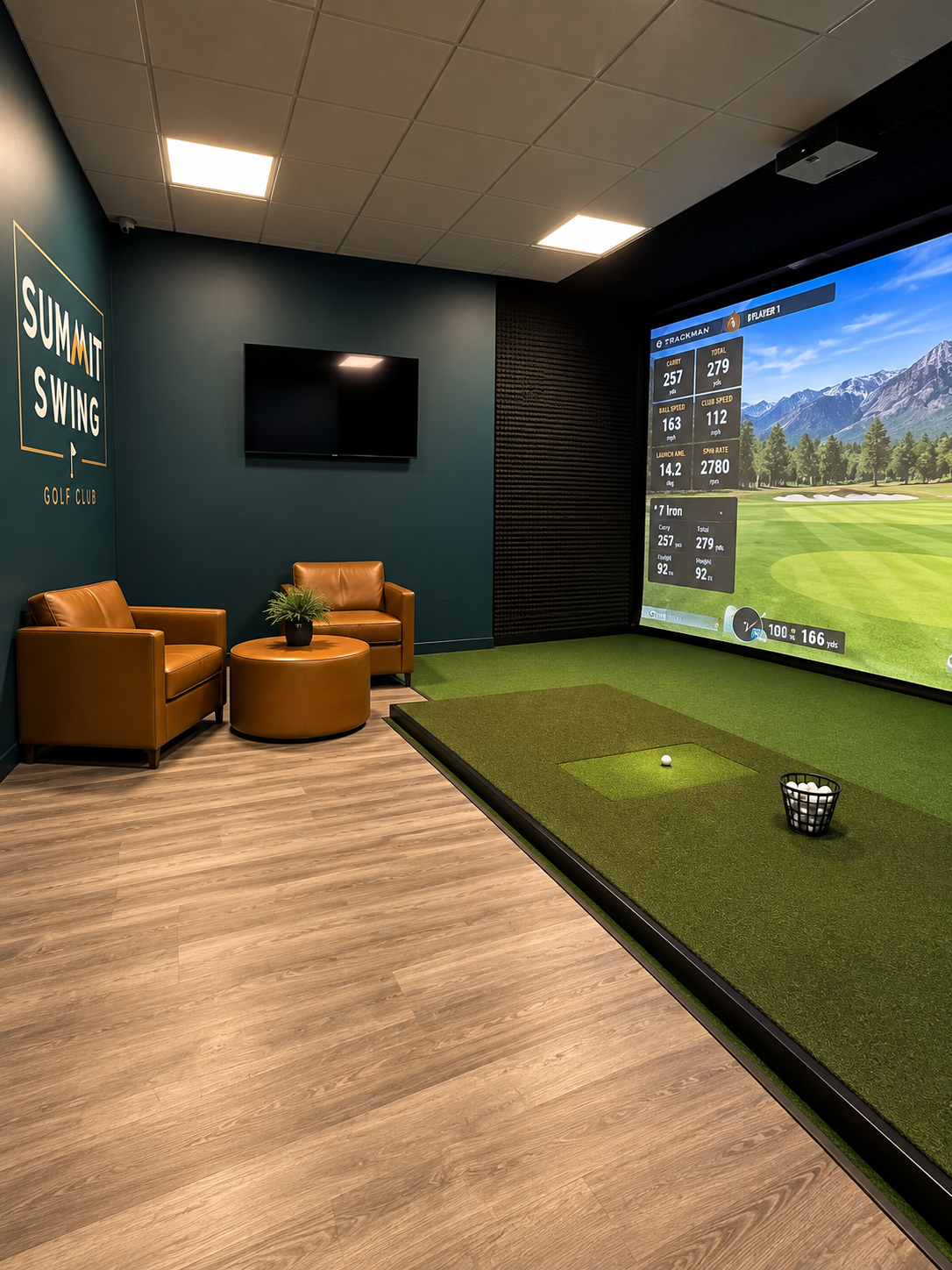 Private golf simulator bay with lounge seating at Summit Swing indoor golf in Maple Grove, MN