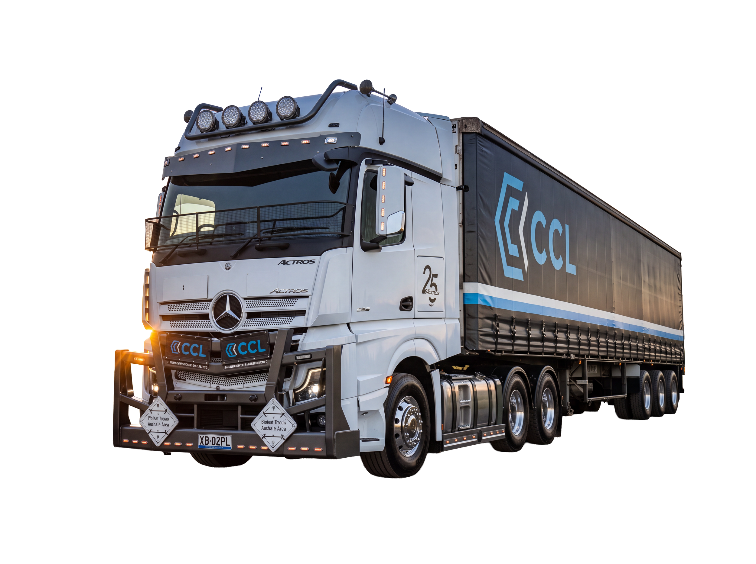 A large transport semi-truck with a dark freight trailer displaying the CCL logo. The truck is white with multiple lights on the top and front, and safety signs on the bumper. The background is black, emphasizing the vehicle.