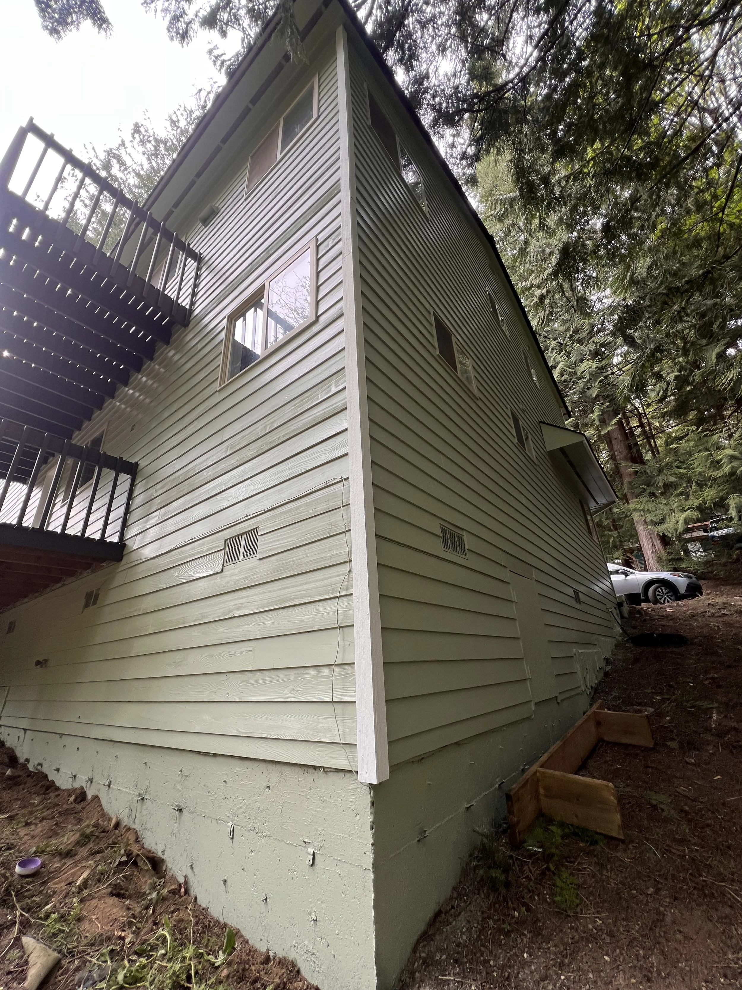 Exterior maintenance on a two-story home in a HOA community 