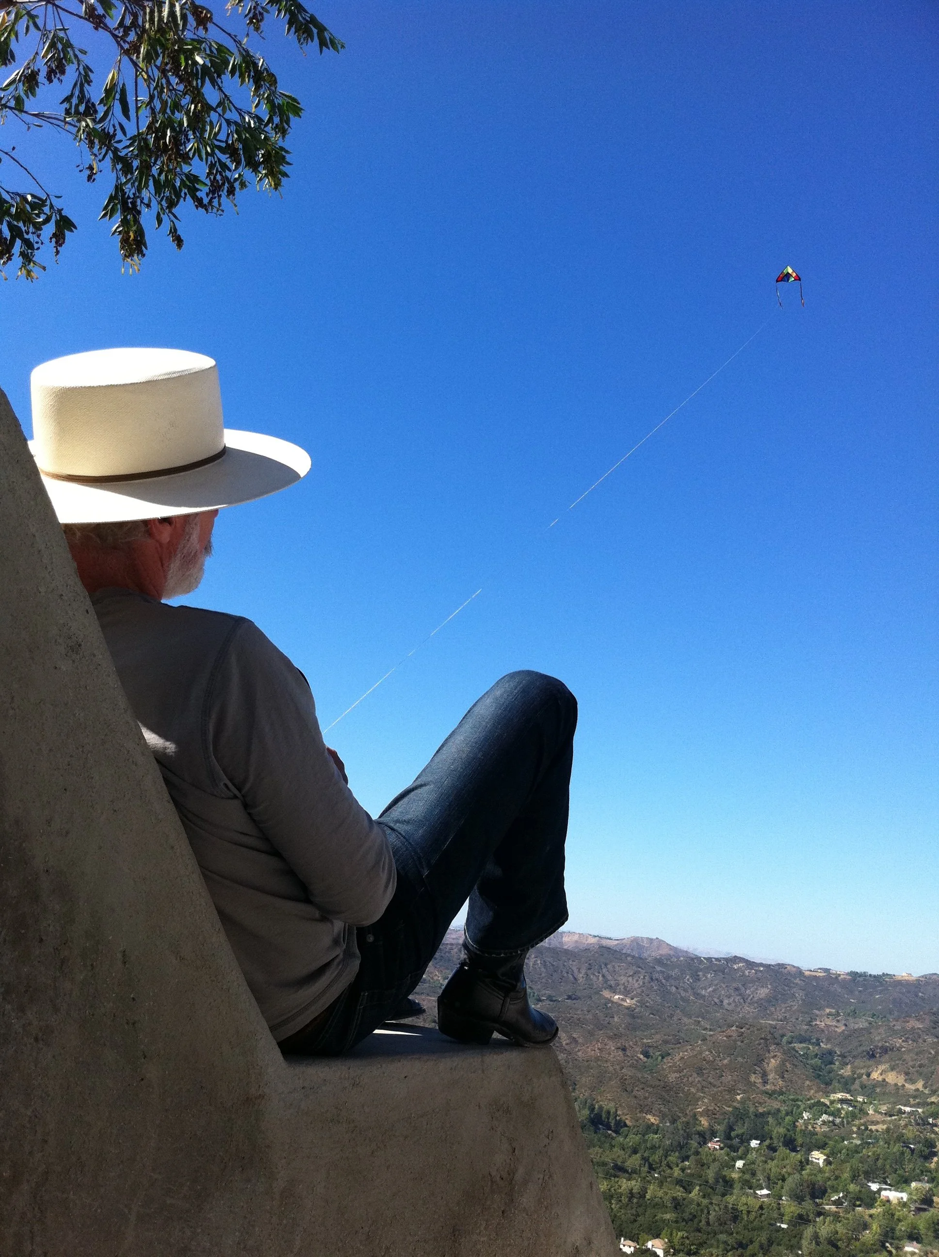 Architect Jack Moses flying a kite in the Santa Monica mountains.
