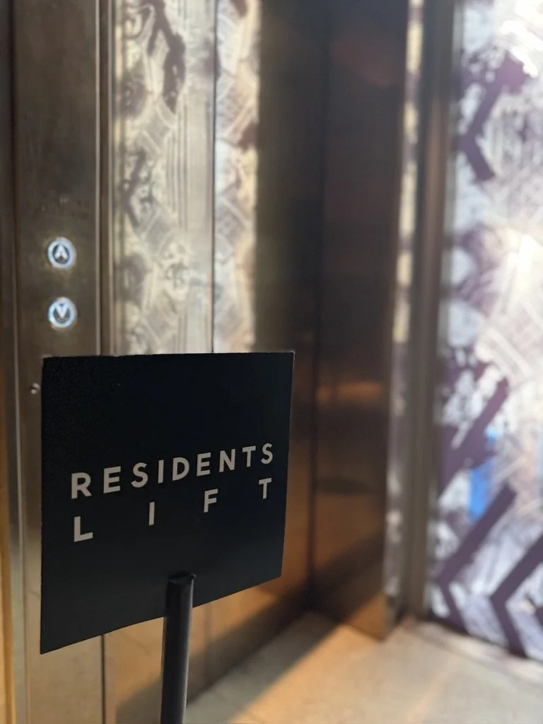Sign indicating the residents' elevator lift door in an apartment building.