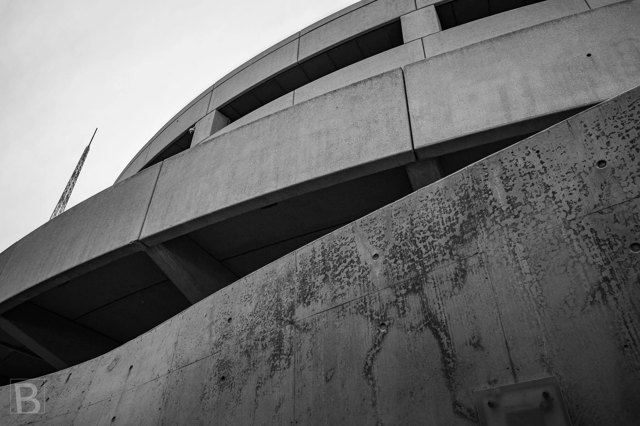 Sweeping infrastructure and weathered surfaces create a restrained
composition of curves, joints and accumulated marks.