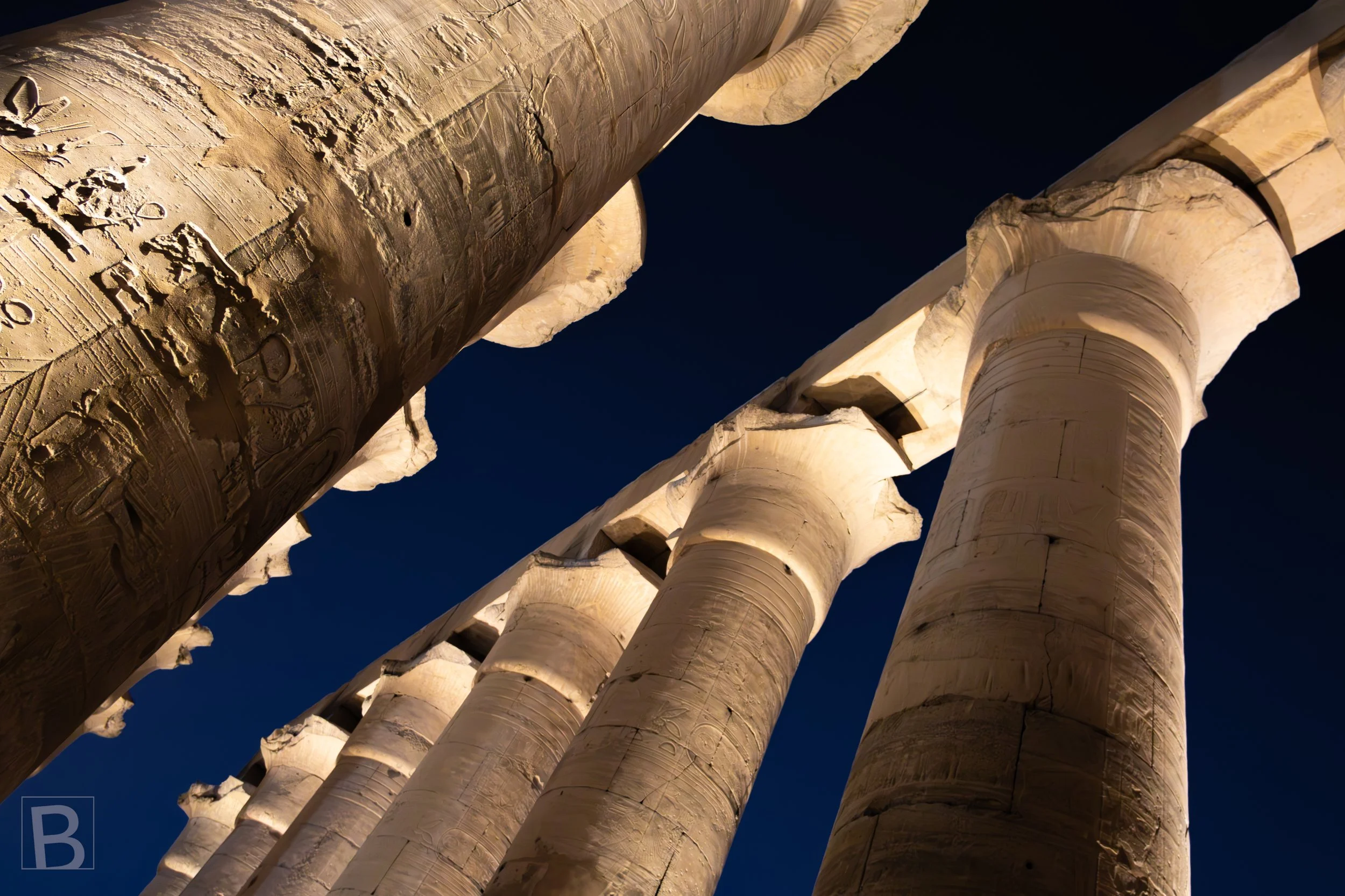 The illuminated colonnade turns massive stone supports into a
repeating field of light and shadow.
