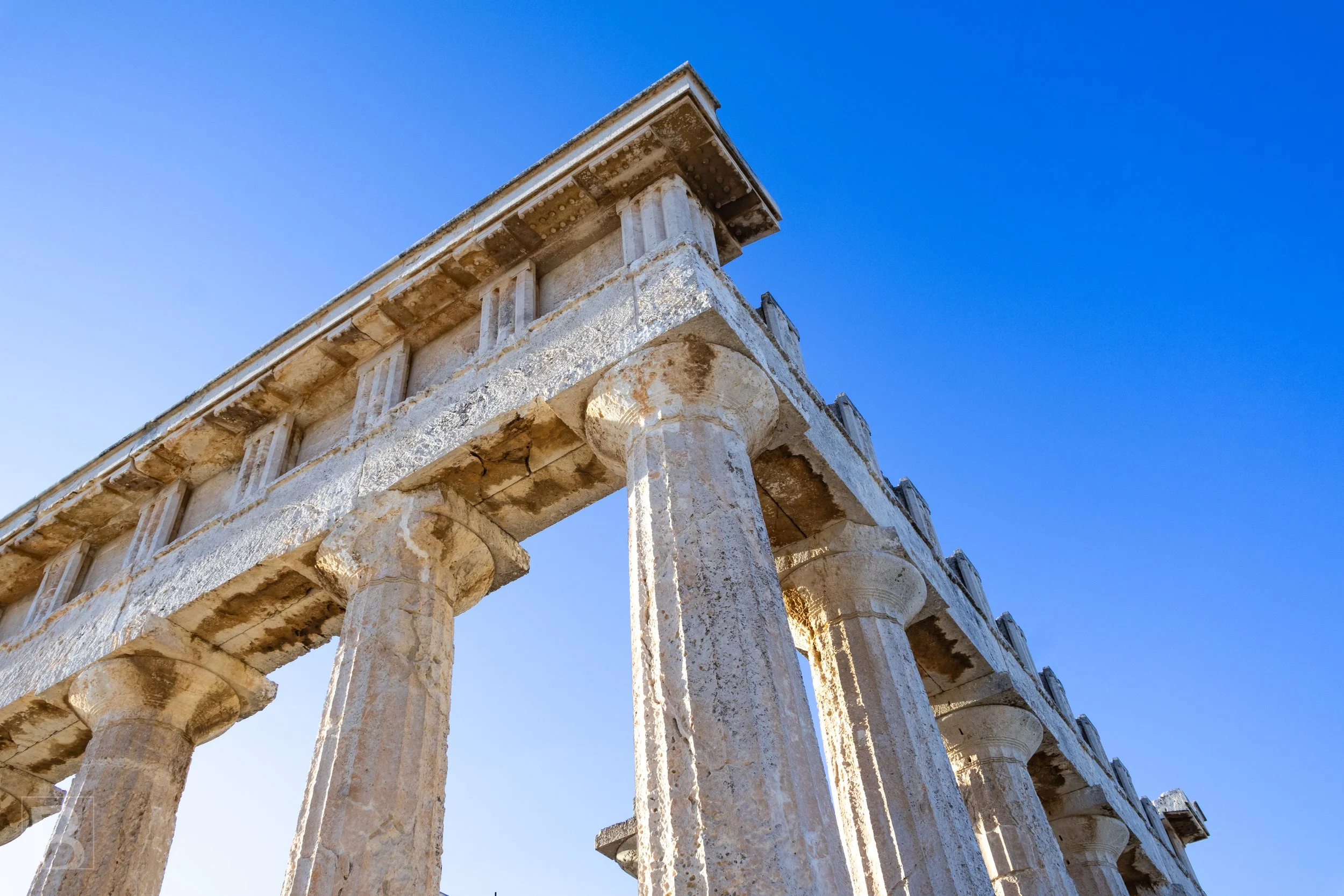 Bright Mediterranean light accentuates the fluting, worn edges and
balanced proportions of an ancient colonnade.