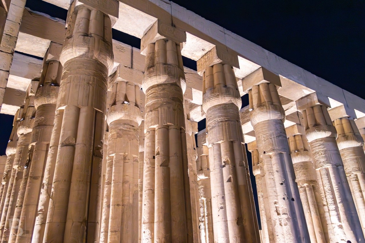 The low viewpoint compresses monumental shafts into a powerful
vertical study of carving, scale and light.