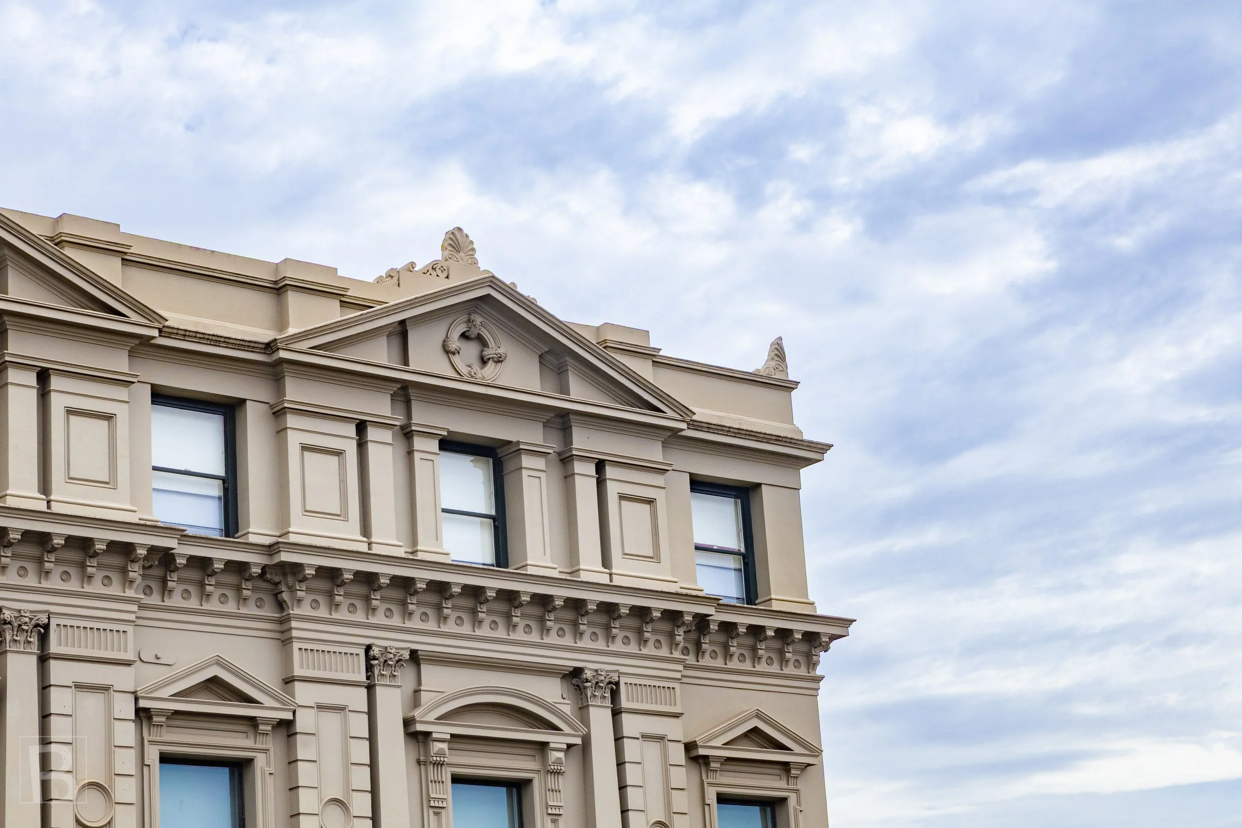 Classical ornament and carefully modelled stonework give this
historic city facade a lasting sense of order and civic confidence.